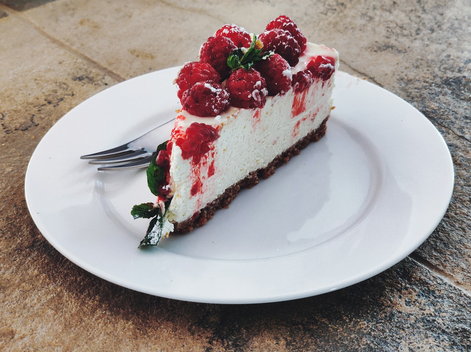 strawberry cake on white ceramic plate